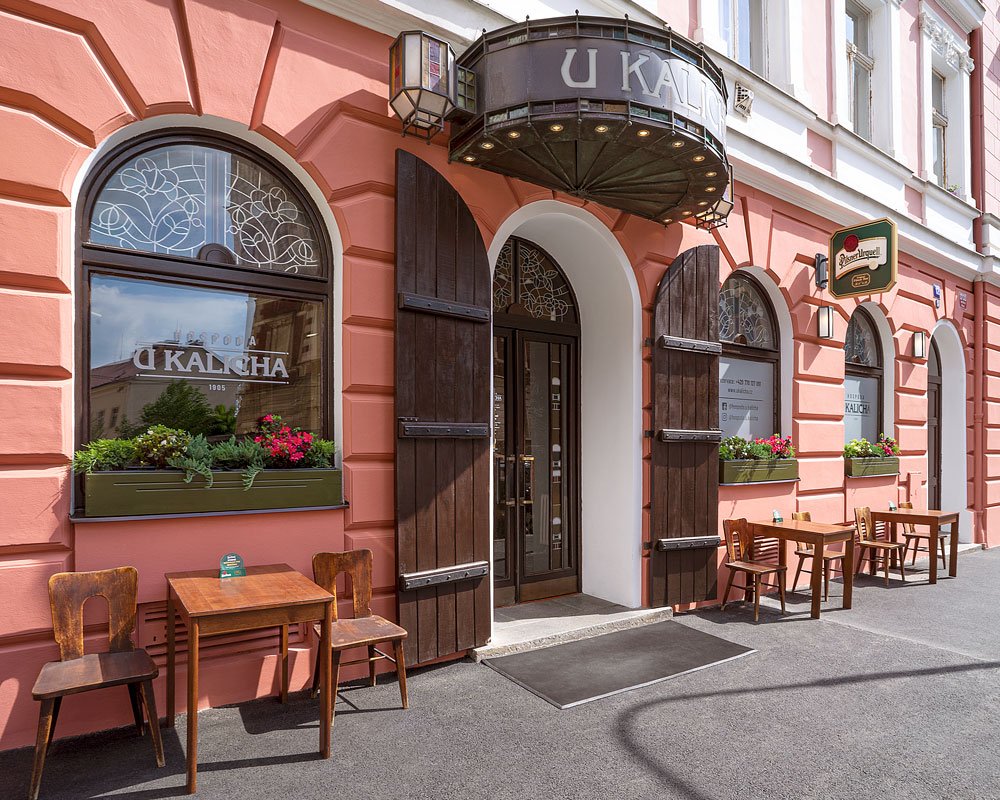 The brewery's pink facade with a large wooden door