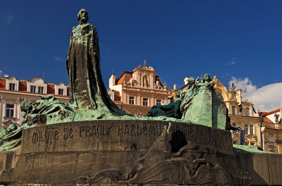 The statues stand on a large pedestal