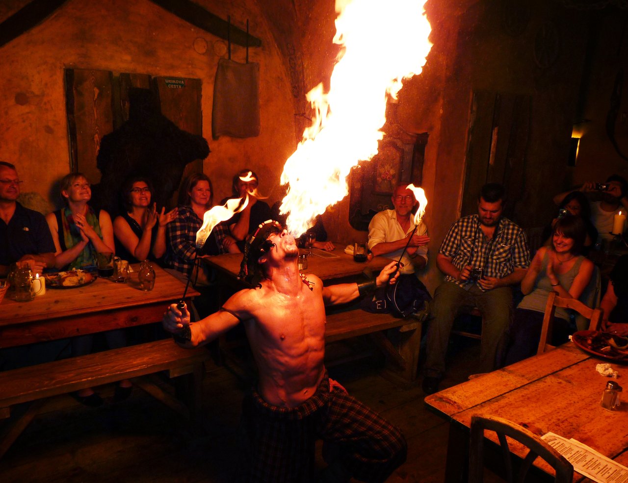 A fire-eater shoots out a huge flame
